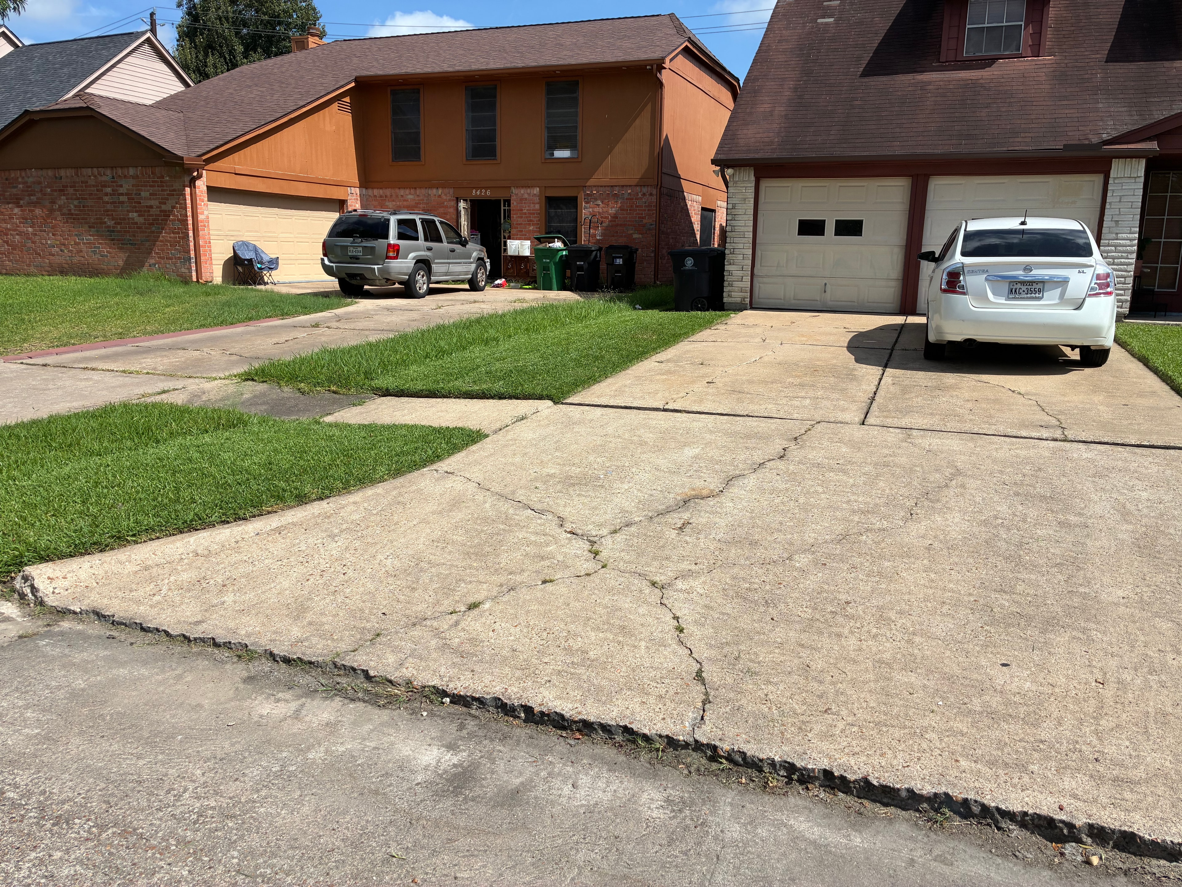 Residential street with freshly mowed lawns and clean curb edging